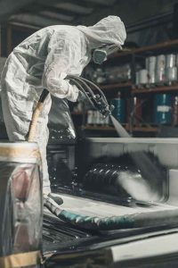 1039 66c3afed868079de21667b15 5e947fc89c30ca7410c04ab4 bed liner being applied to truck 1